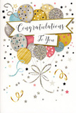 This congratulations card feels like a quiet burst of happiness captured on paper, the sort of thoughtful touch you might find accompanying a celebratory bouquet delivered to a doorstep off Chase Side in Southgate. Dominating the composition is a tall, gathered spray of balloons, drawn with a soft, painterly precision that makes them appear simultaneously weightless and substantial. Rounded and full, the balloons overlap in a gentle cascade of colour: warm golds, cool silvers, champagne tones, airy sky blue, blush pink, and soft dove grey. Each carries its own decorative story, from fine metallic stripes that catch an imaginary light to tiny stars and glittering flecks that suggest sparkling confetti. The artist has accented the curves and edges with subtle highlights and shadows, giving the sense that these balloons might actually float if you tugged their strings. Those strings fall in elegant, curling lines of gold and silver, converging at a neat point near the bottom and adding a sense of structure. Around the main cluster, the pale background is enlivened with miniature stars, dots, and swirling ribbon shapes, echoing the easy exuberance of a well-loved party. Stretching horizontally across the centre of the design is a soft banner, gently arched and lightly shaded, carrying the words Congratulations To You in flowing, ornate handwriting. The overall look suggests a high-quality card with a smooth base, accented by raised glitter details that would feel slightly textured under your fingertips. Paired with a fresh floral arrangement from a local Southgate florist, this card would beautifully convey pride, joy, and sincere recognition of a special achievement.